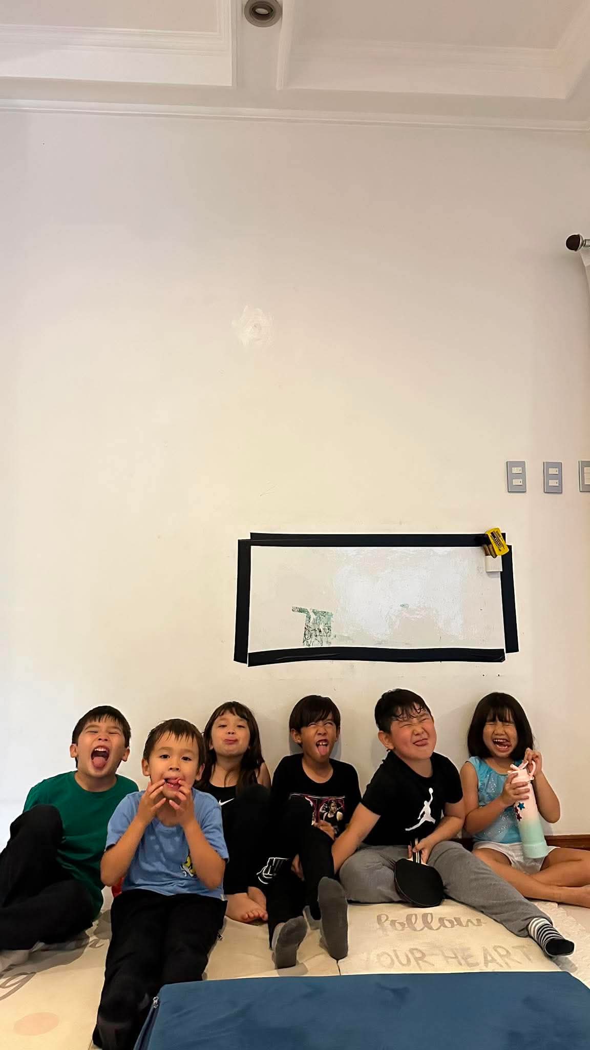 Kids making funny faces together at Coach Von's Little Tumblers